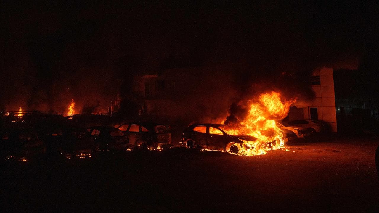 Cars burn after a Russian strike in Kyiv, Ukraine