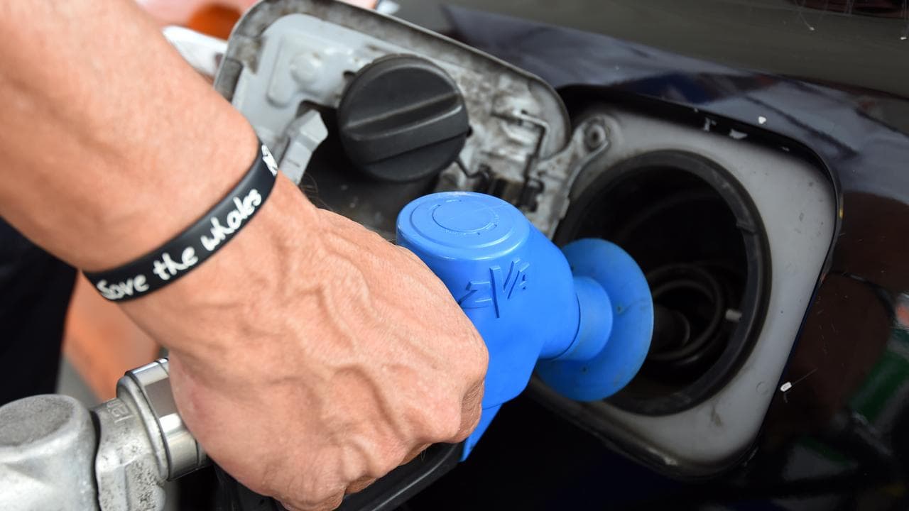 A motorist refuels his car