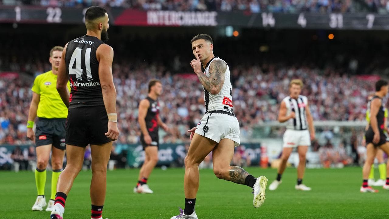 amie Elliott had a quiet word with Essendon defender Saad El-Hawli.