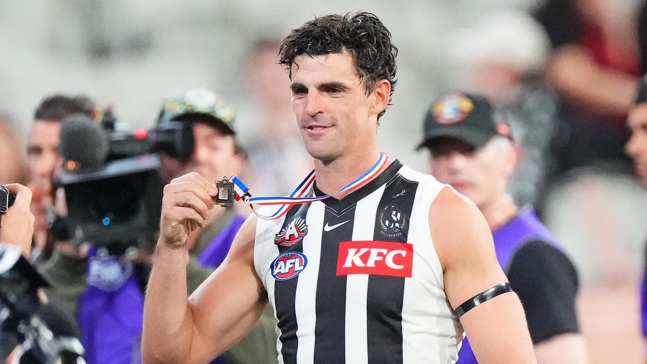 Scott Pendlebury of the Magpies with the Anzac Medal