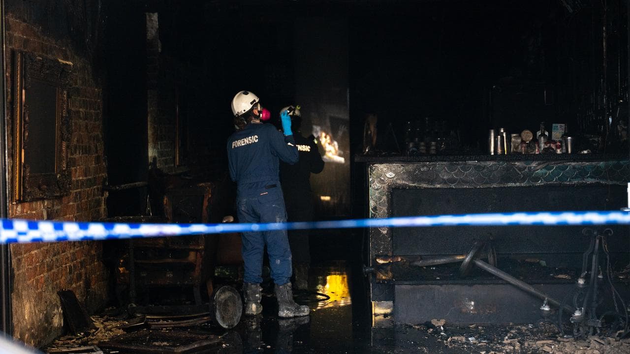 Police at a suspected firebombing of a bar (file image)