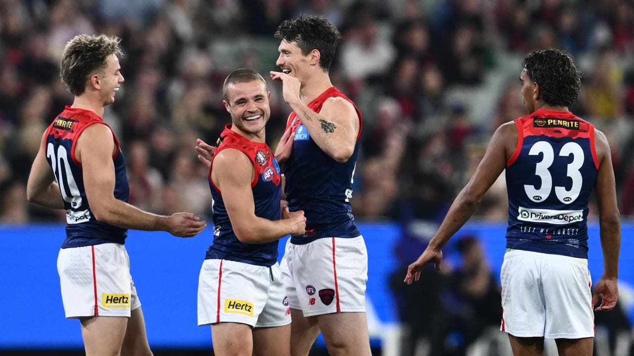 Melbourne players celebrating a goal.