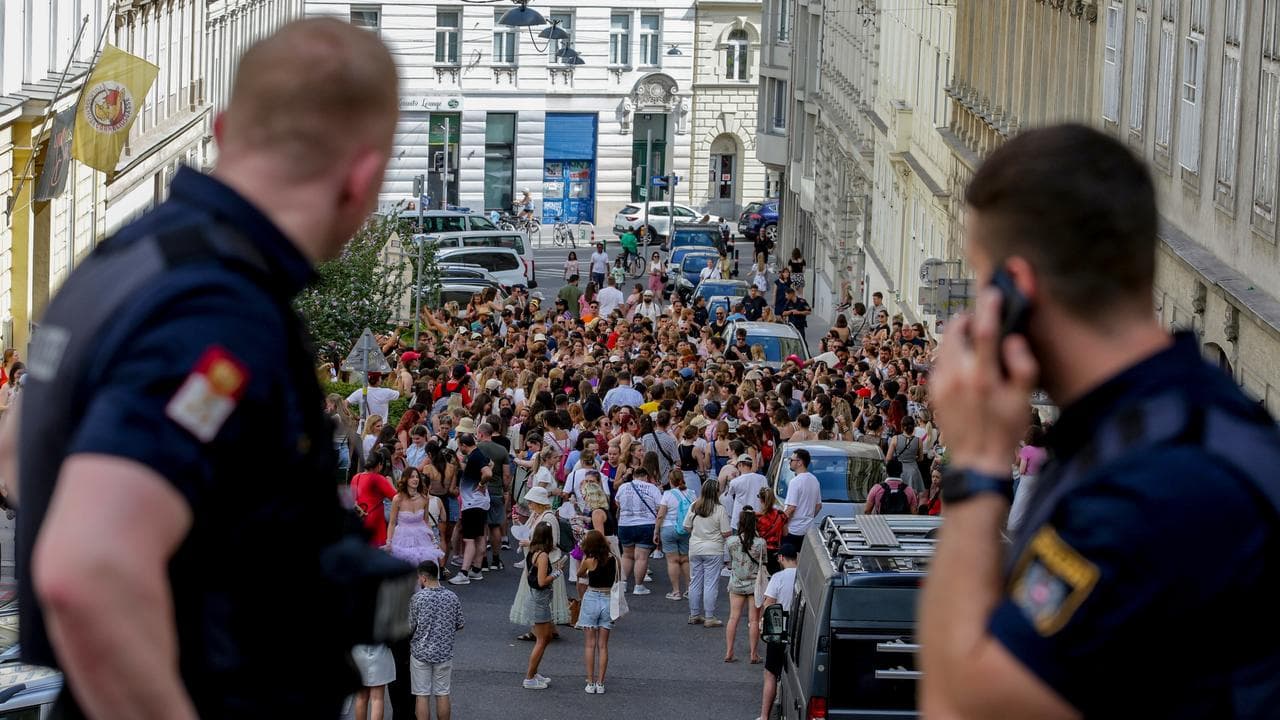 Police watch a gathering of Taylor Swift fans in Vienna in 2024