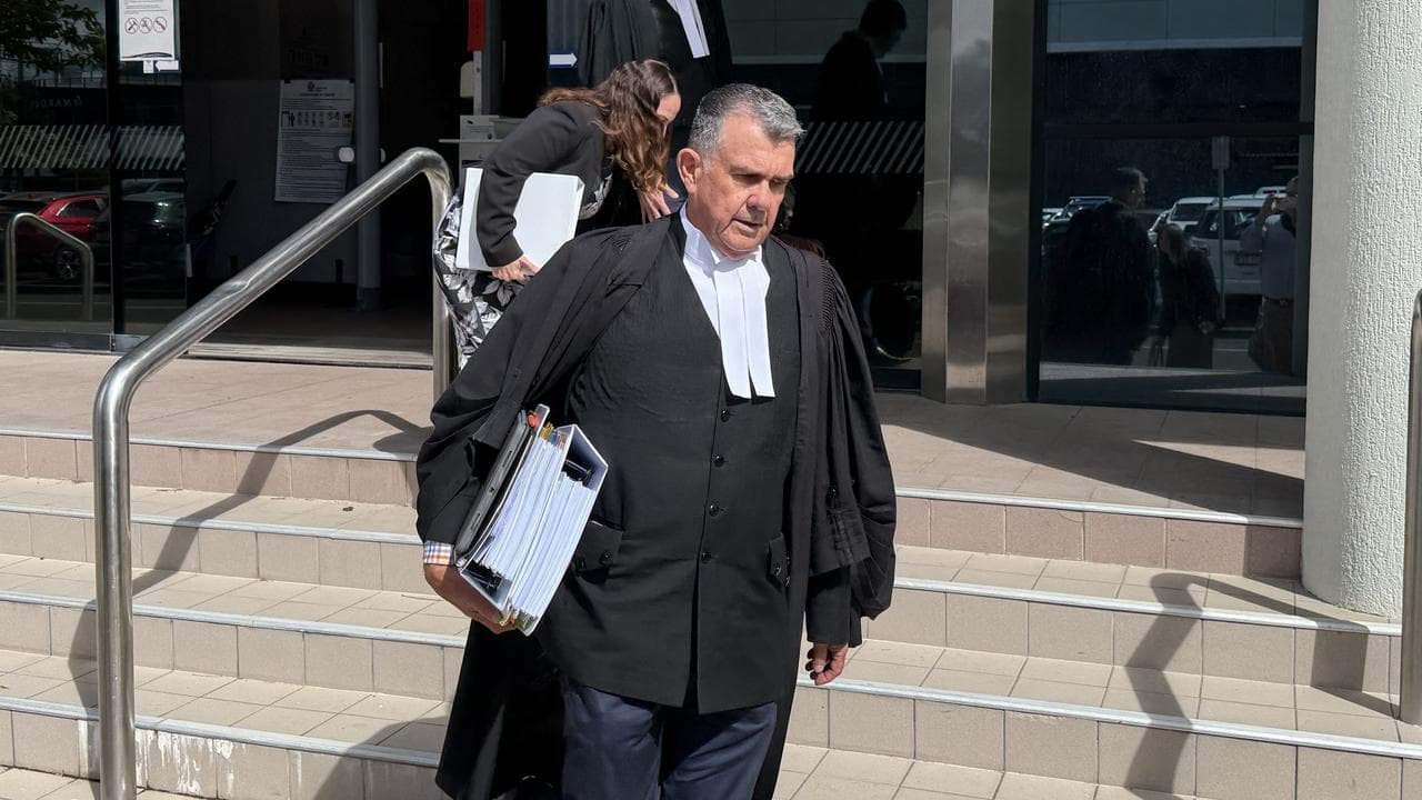 Barrister Simon Lewis (front) 