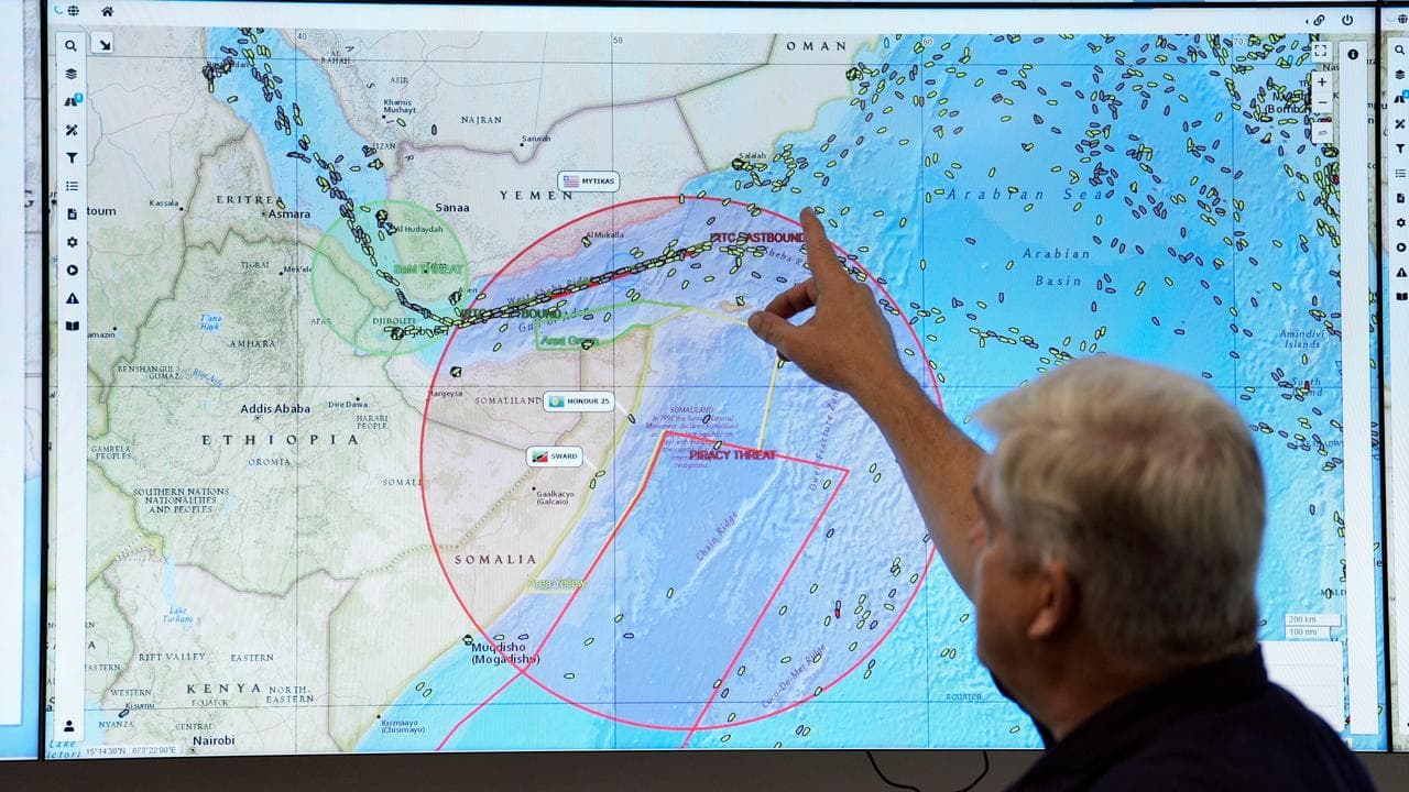 Screens showing shipping in the Middle East in Portsmouth, Britain