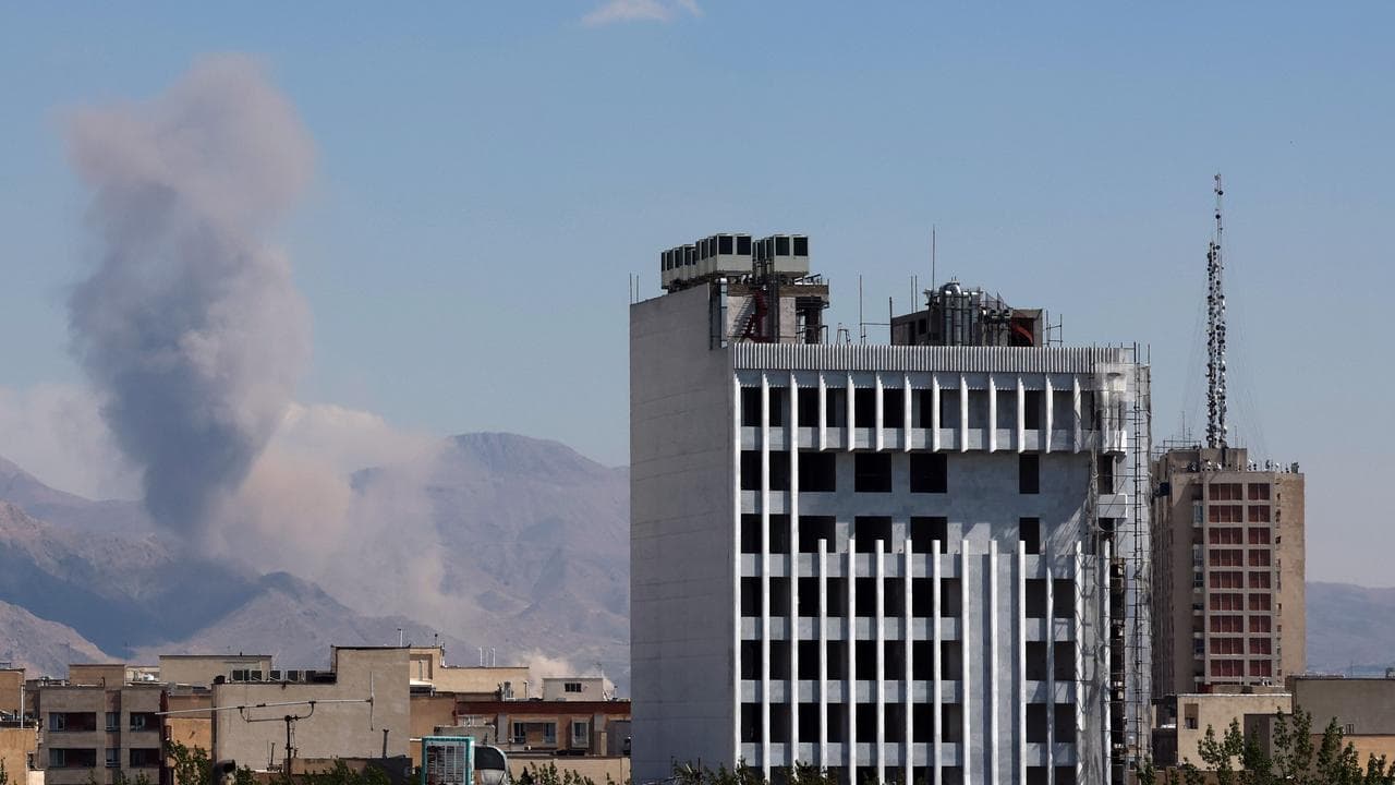 Smoke rises following a US-Israeli airstrike in Tehran, Iran