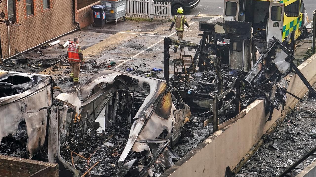 Burnt ambulances in a car park at Golders Green in London