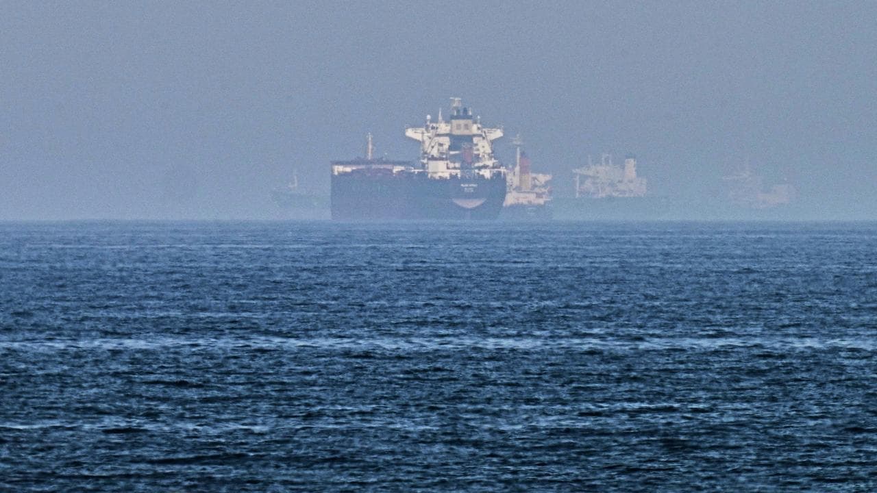Cargo ships are seen at sea near the Strait of Hormuz
