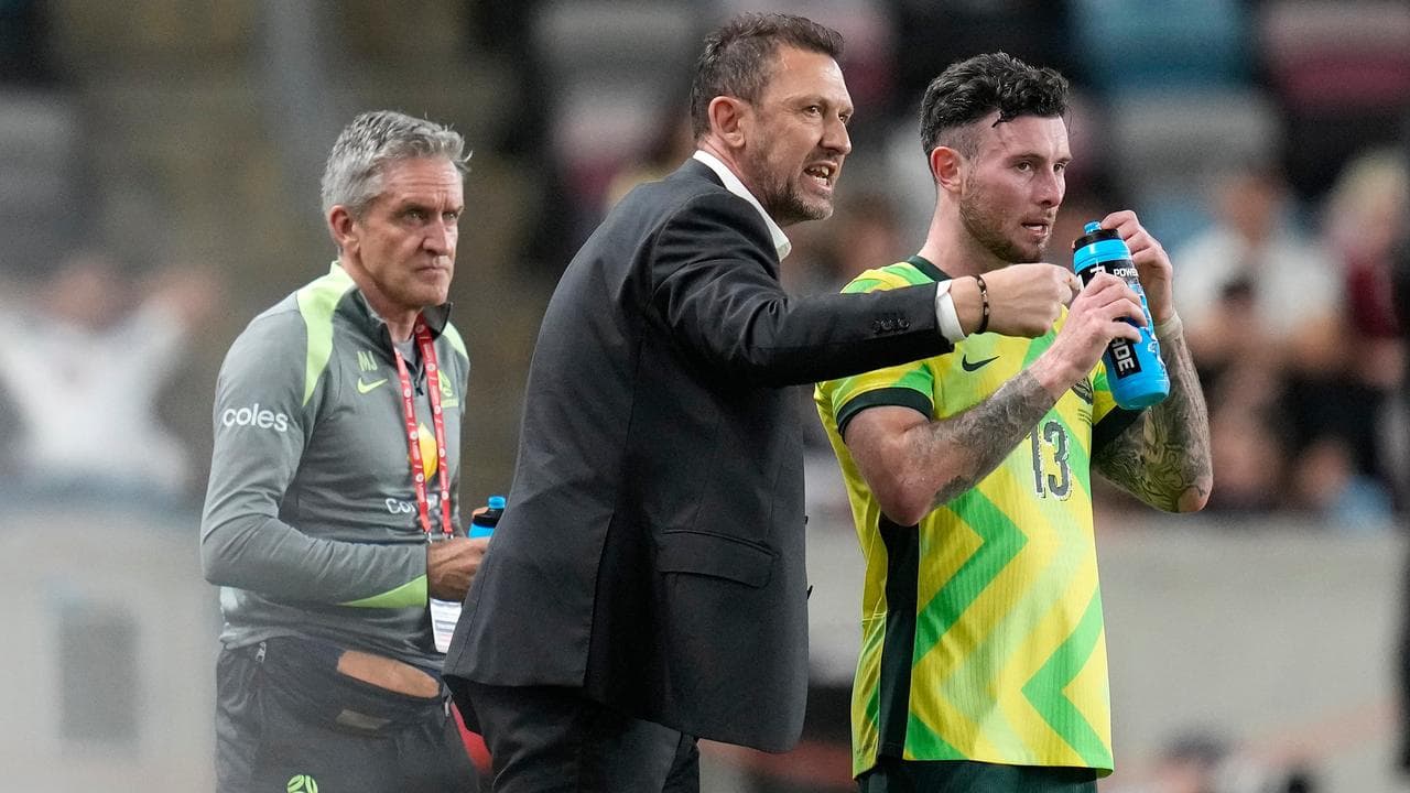 Tony Popovic talks with Aiden O'Neill.