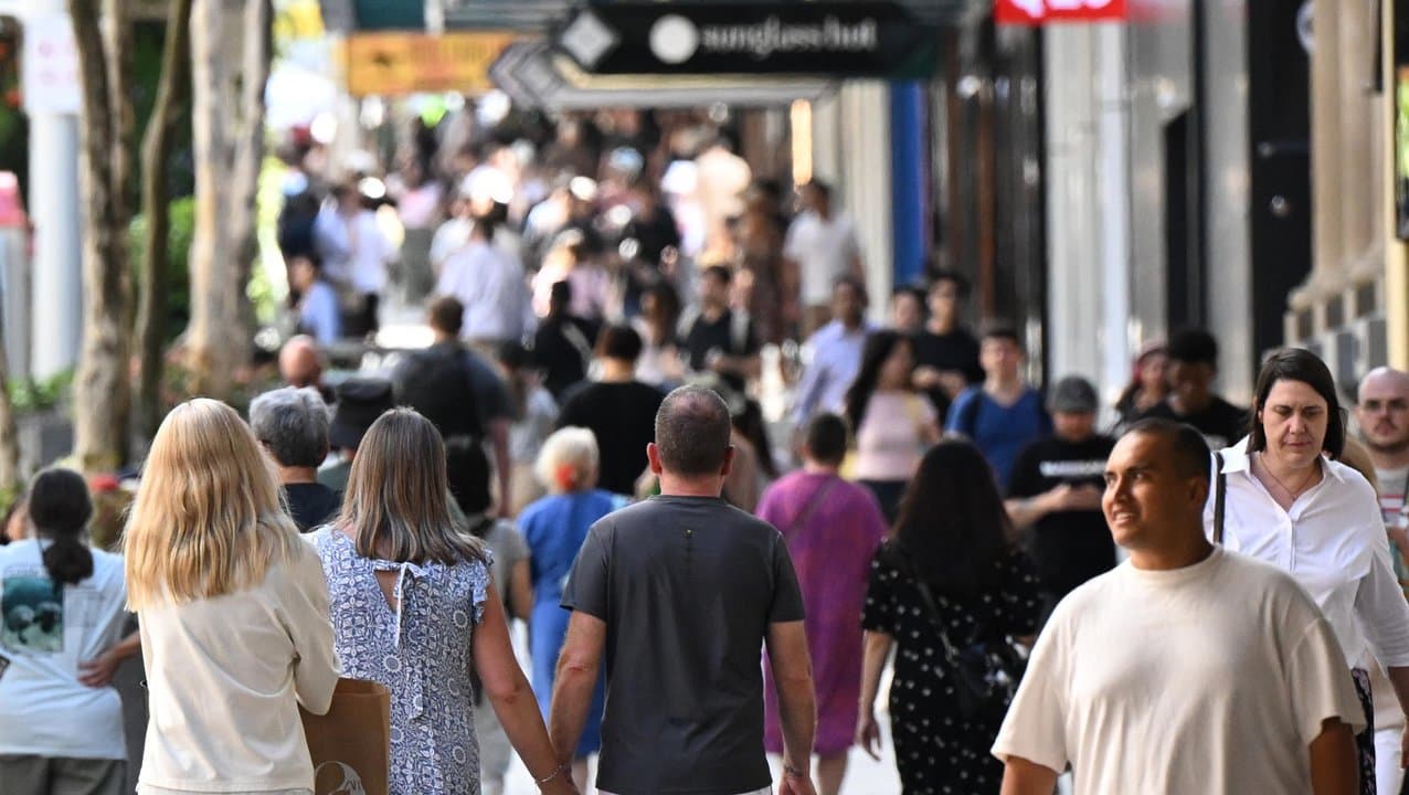 People are seen in the Queen Street Mall in Brisbane