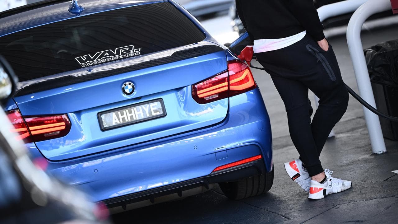 A motorist at a petrol station