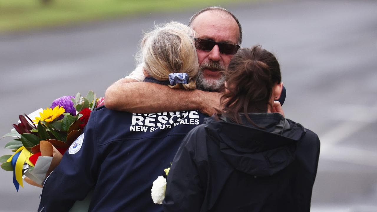 Ballina locals pay their respects outside the Marine Rescue Centre