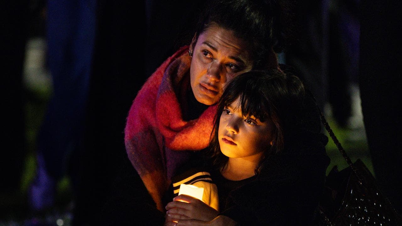 People gather during the Safe Steps Candlelight Vigil in Melbourne
