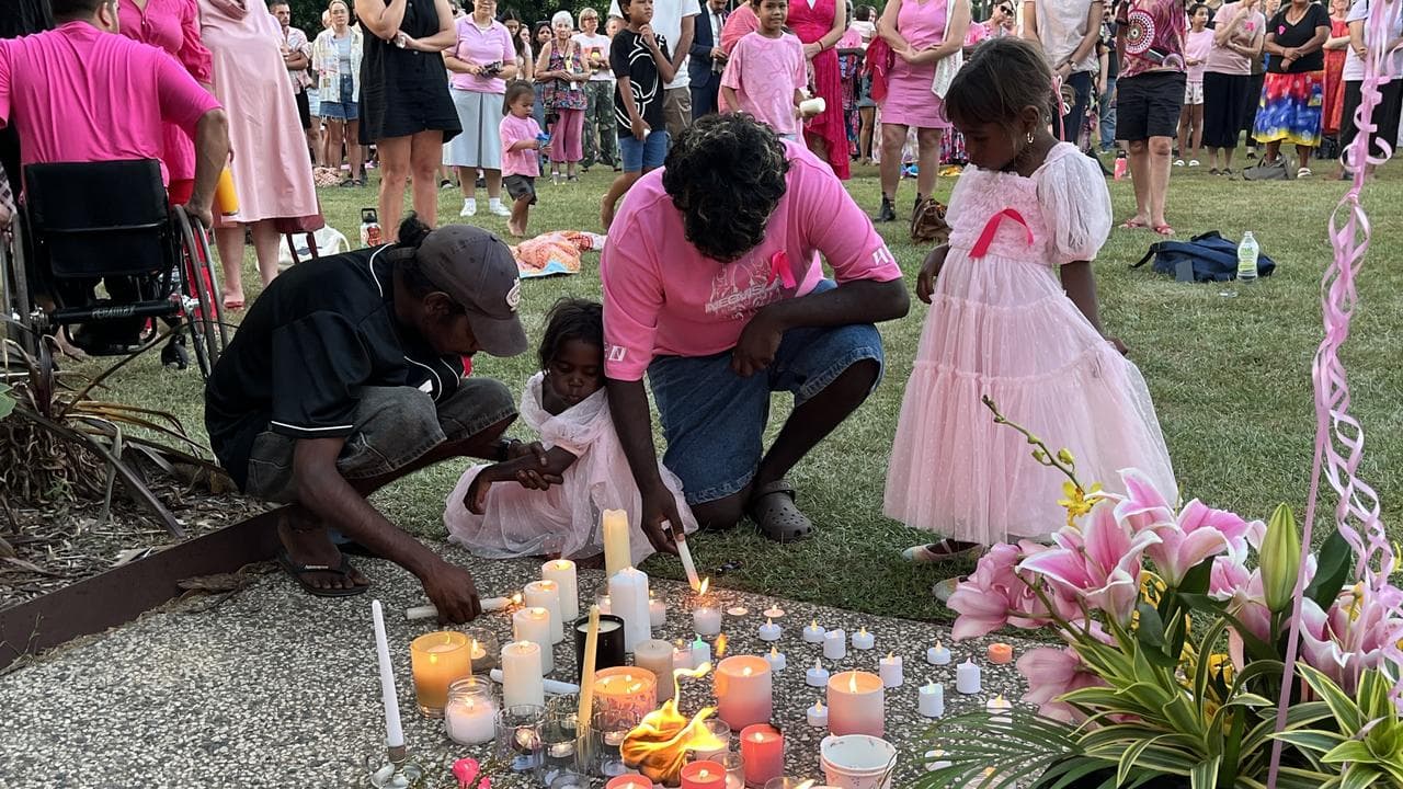 Mourners wear pink during a vigil for Kumanjayi Little Baby, Darwin