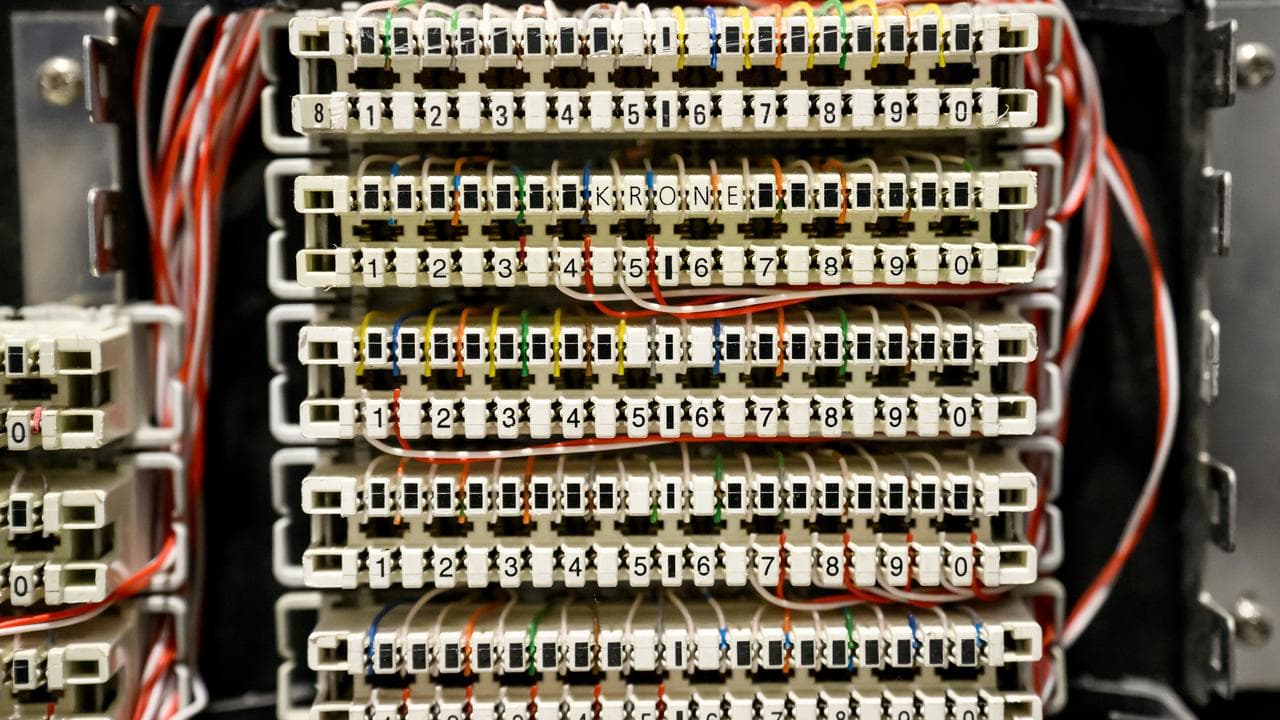 Cabling and switches are seen in a server room