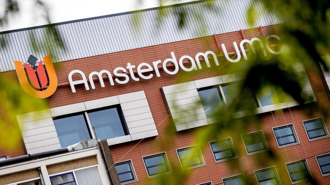 The Amsterdam UMC logo on the hospital's facade in Amsterdam