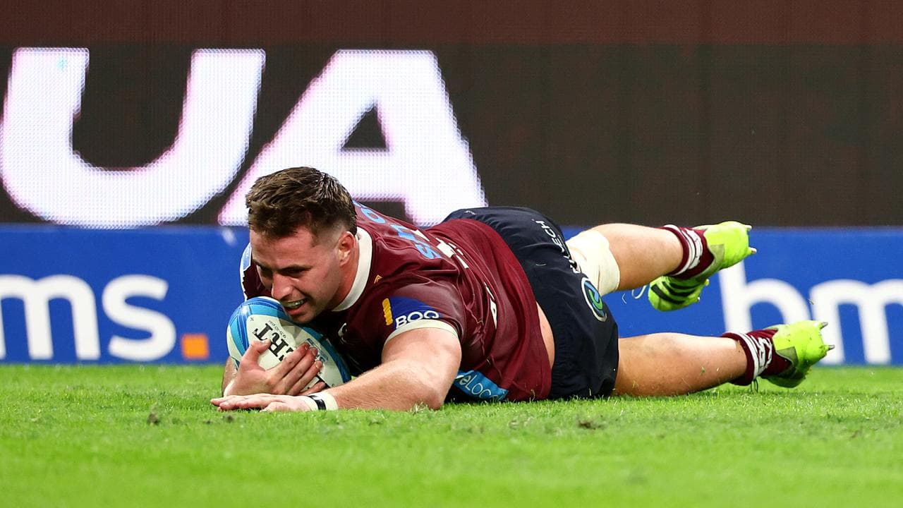 Joe Brial of the Reds  scores a try