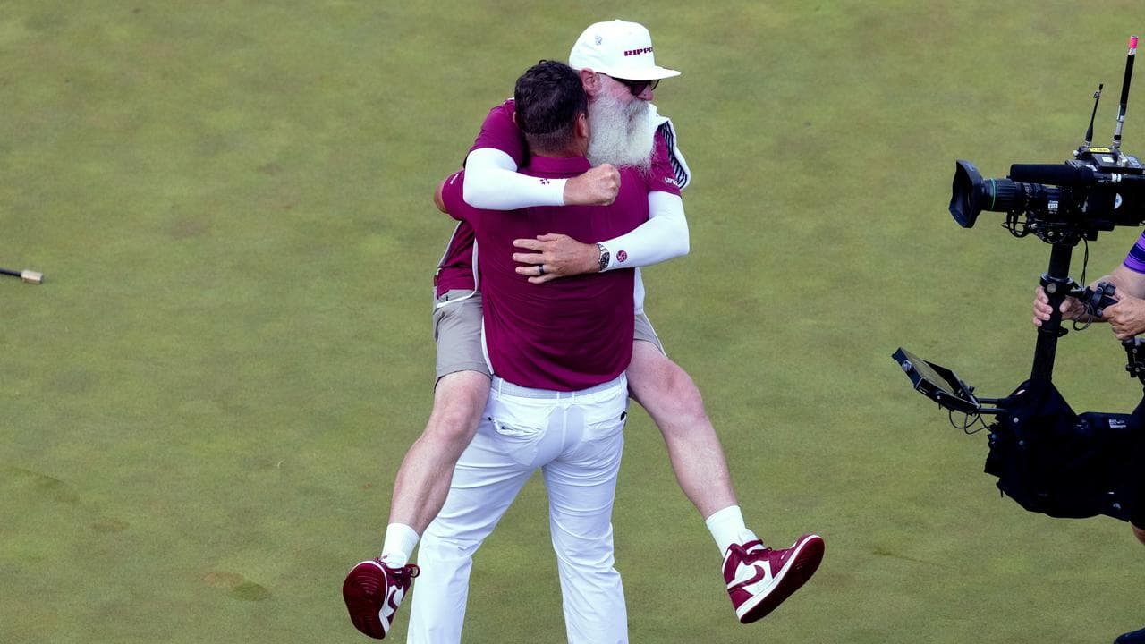 Caddie Nick Pugh gave Lucas Herbert a huge hug
