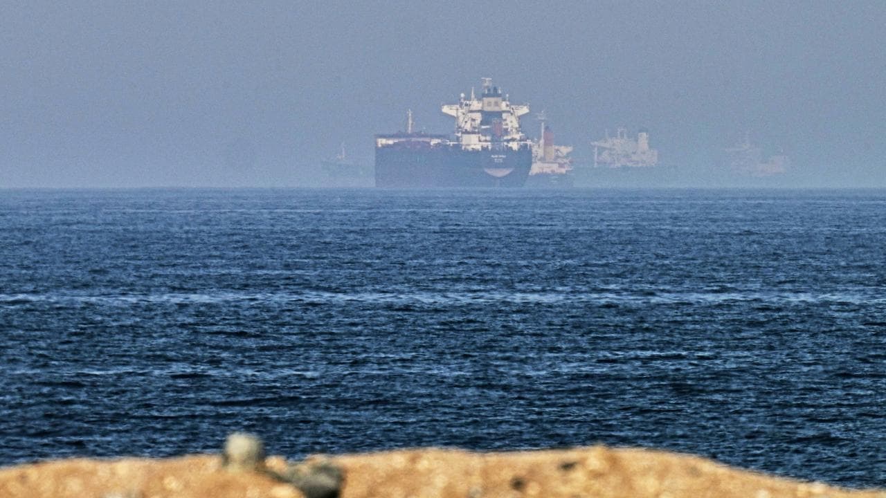 Cargo ships are seen at sea near the Strait of Hormuz