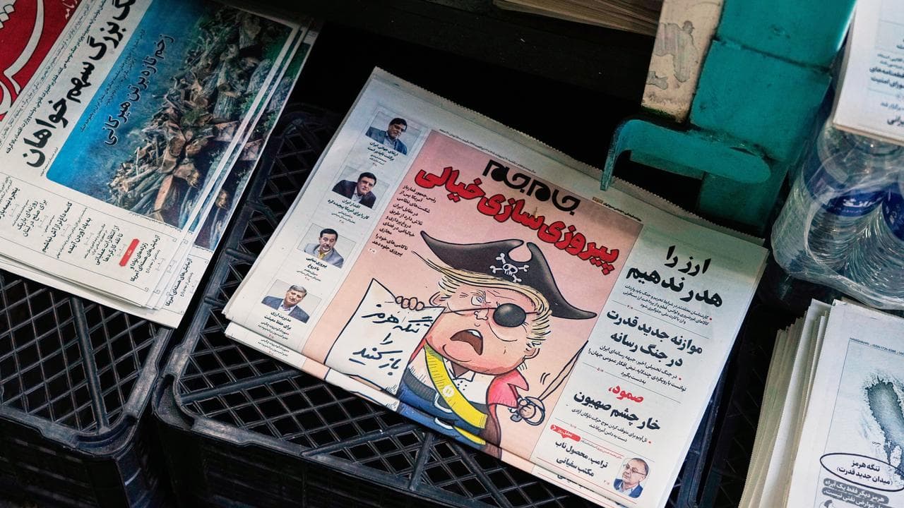 An Iranian newspaper with a cartoon of US President Donald Trump