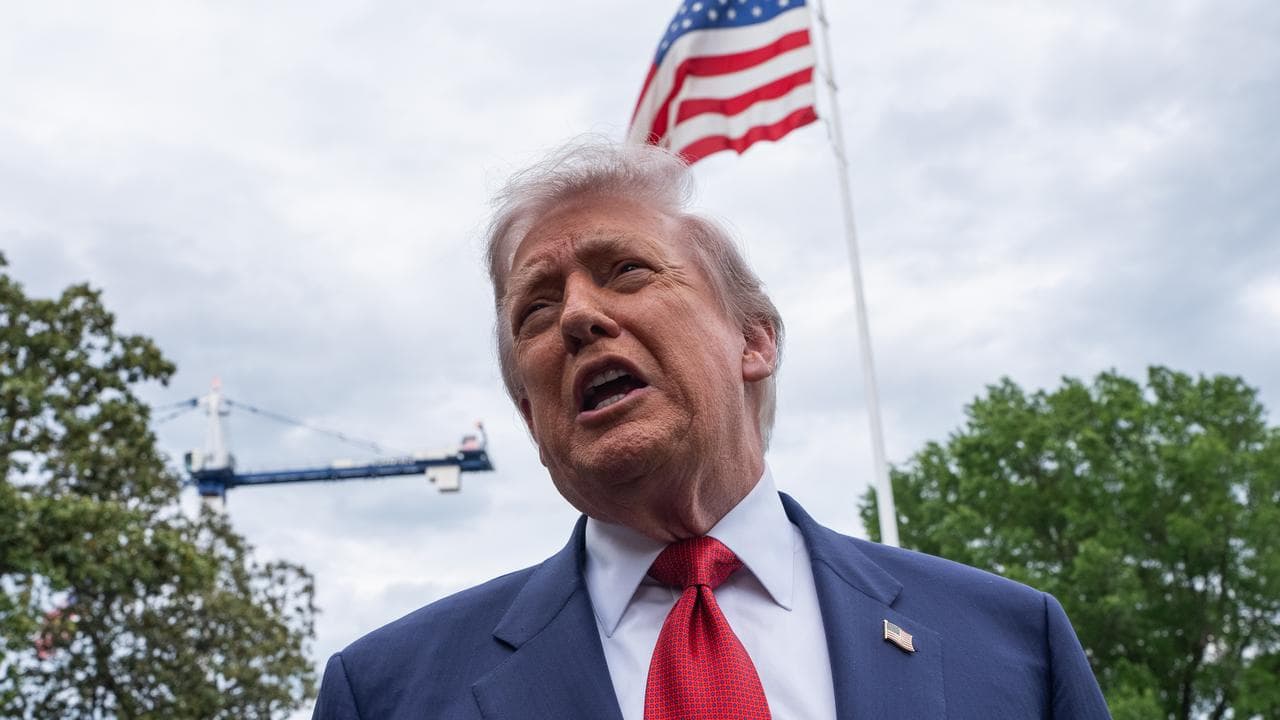 US President Donald Trump speaks to media as he leaves the White House