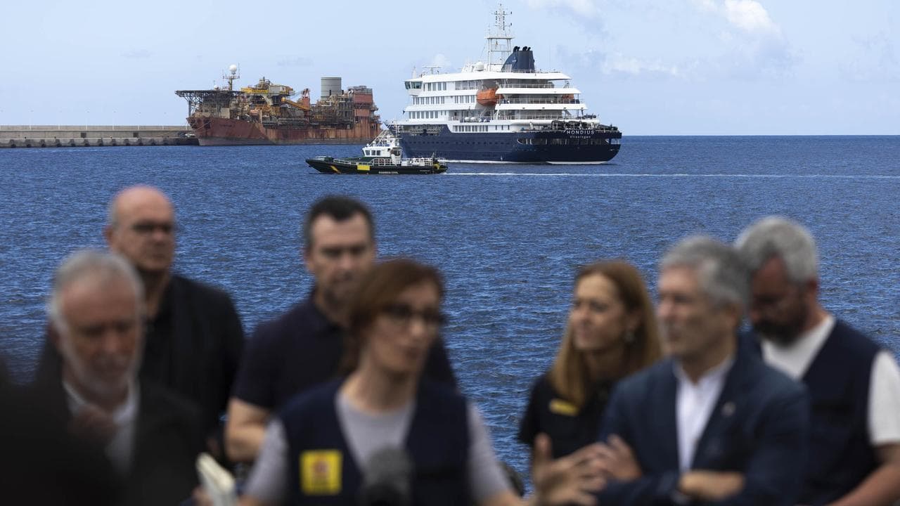 MV Hondius is seen while Spanish ministers give an update in Tenerife