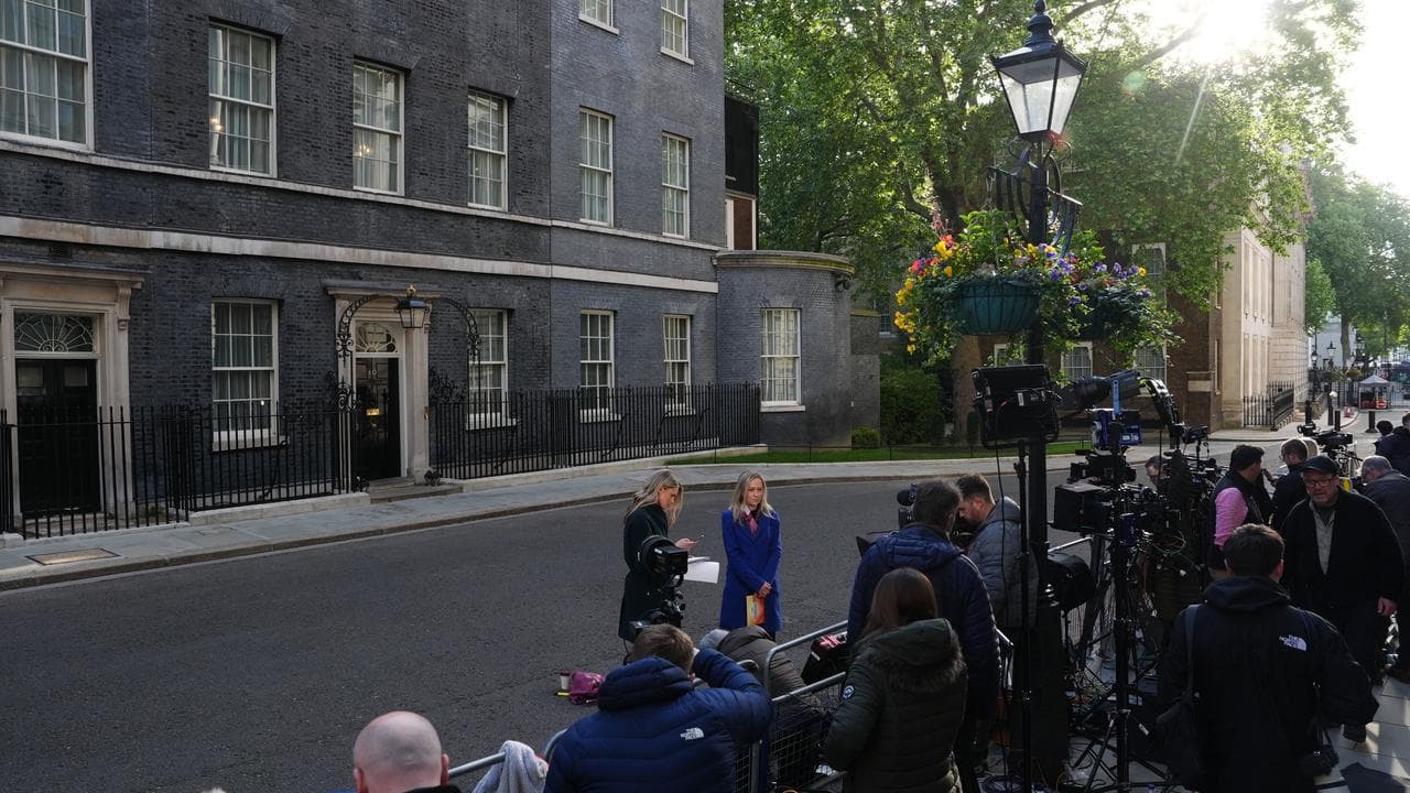 Media gathers in Downing Street ahead of a cabinet meeting, in London