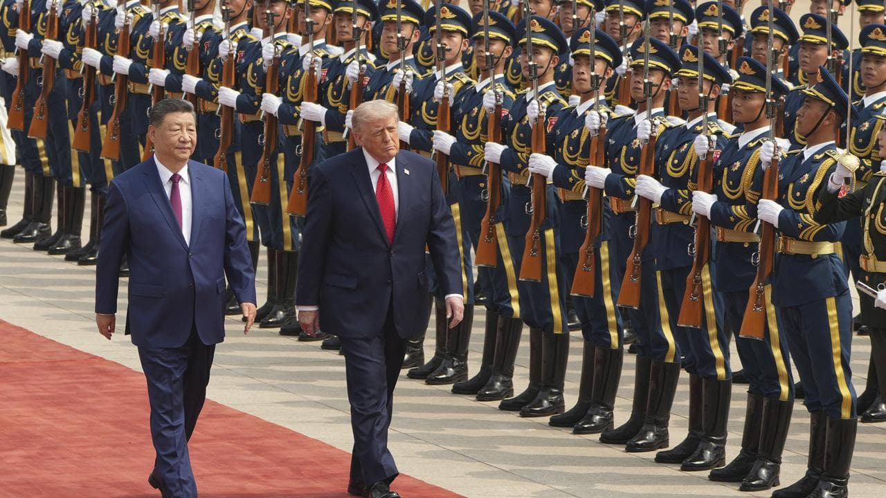 Donald Trump takes part in a welcome ceremony with Xi Jinping