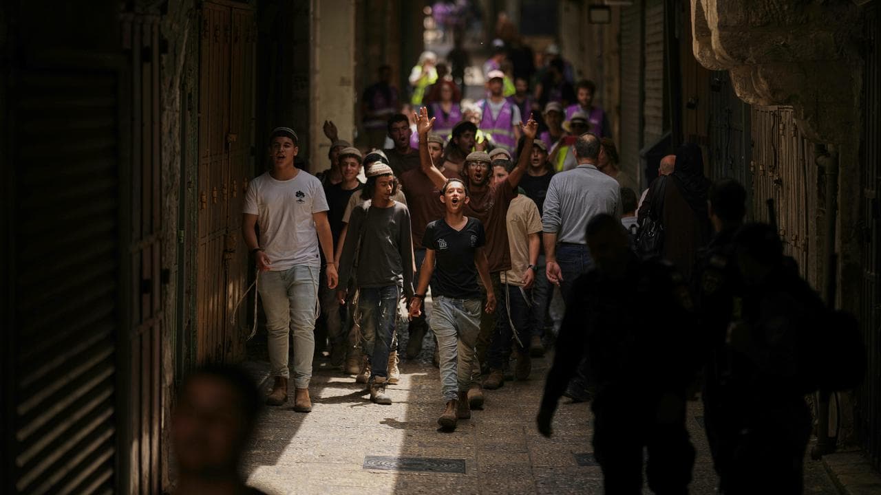 Israeli youth walk through the streets of the Old City