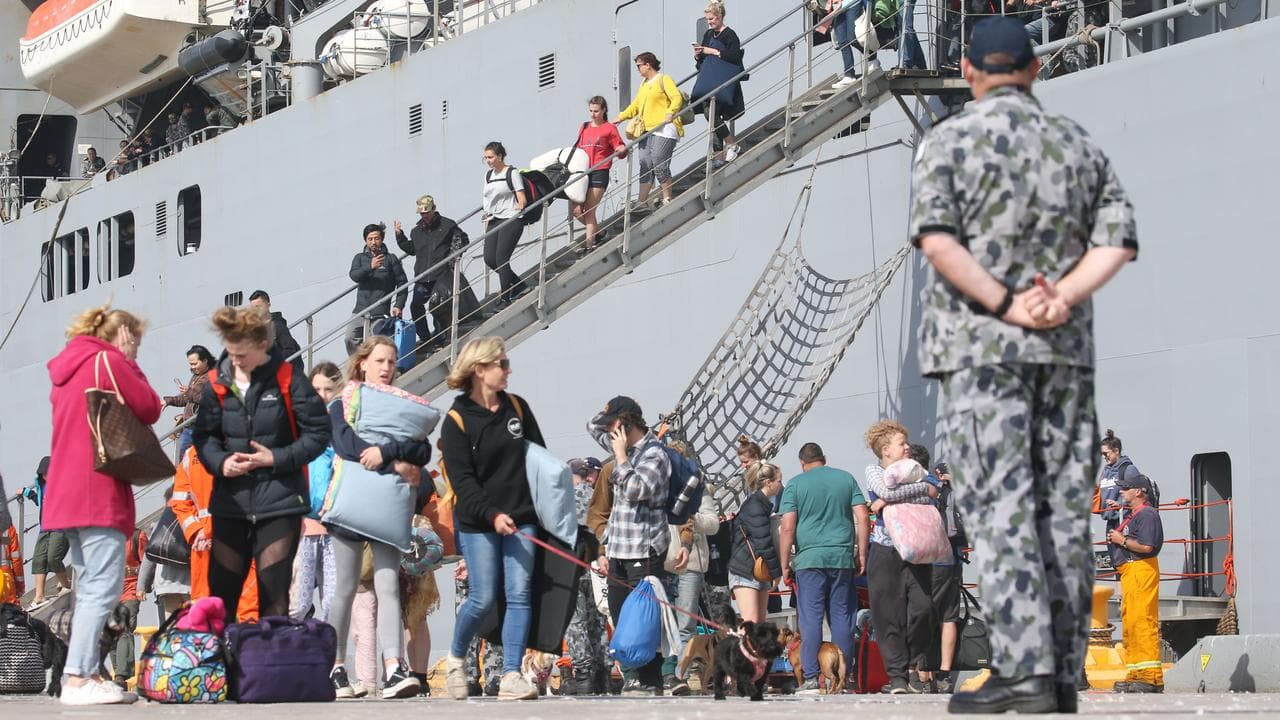 Evacuees from Mallacoota arrive on a navy ship