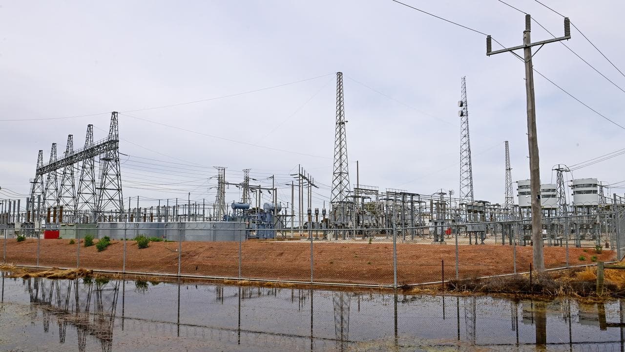 Floodwaters surround a power station