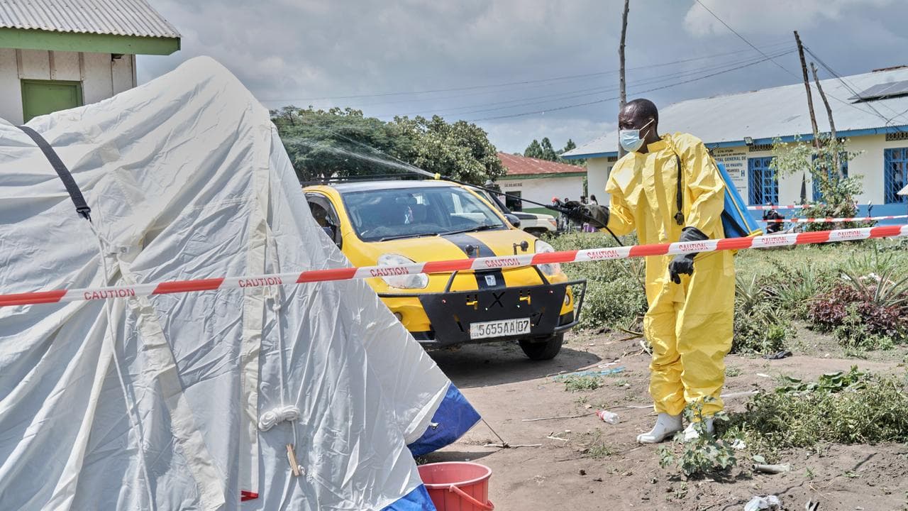 A man sprays a tent at an Ebola treatment centre in Bunia, Congo