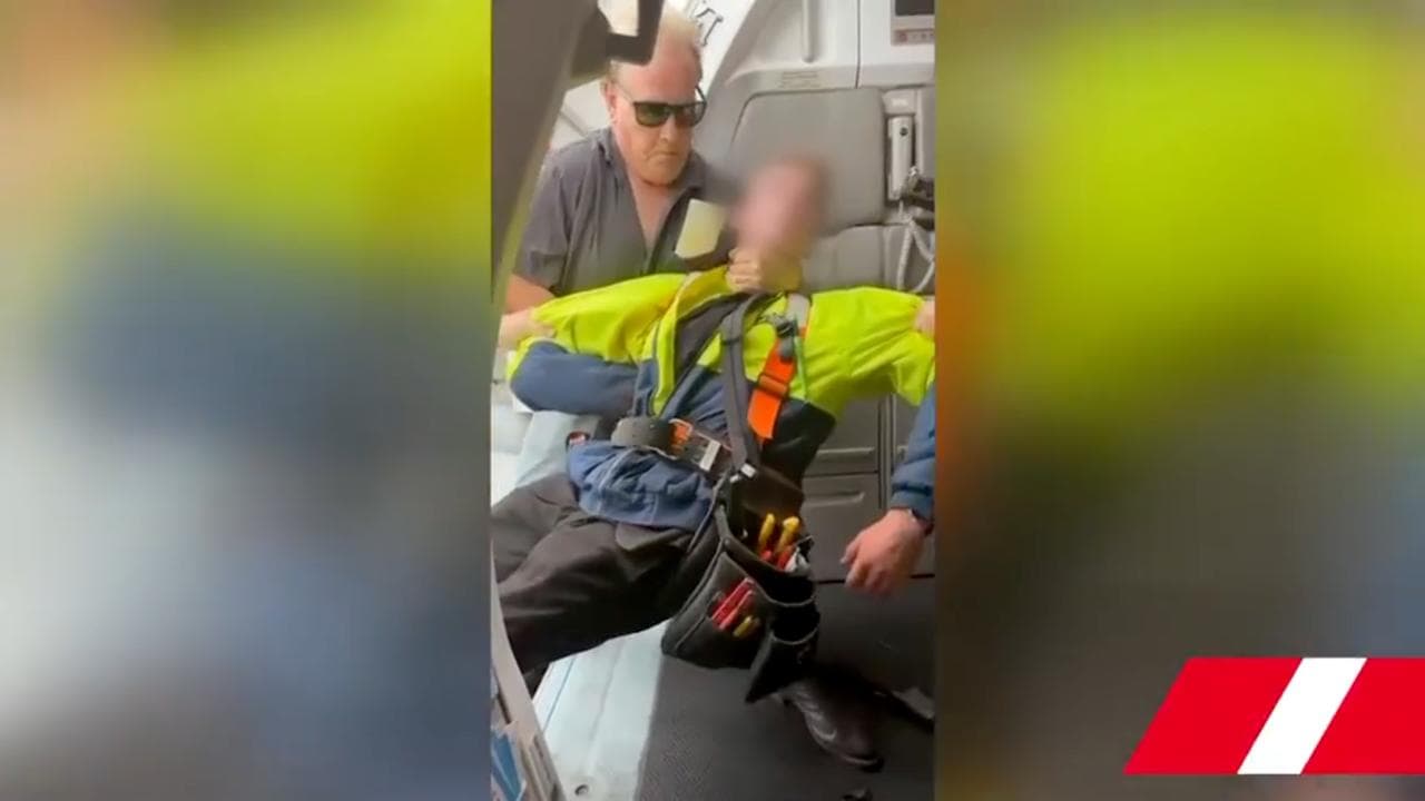 Teen being restrained (file)