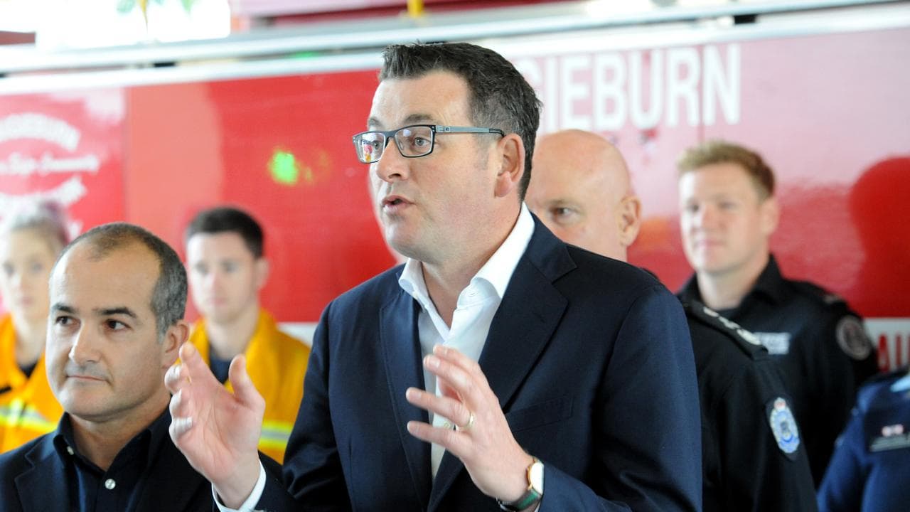 Daniel Andrews with firefighters (file)