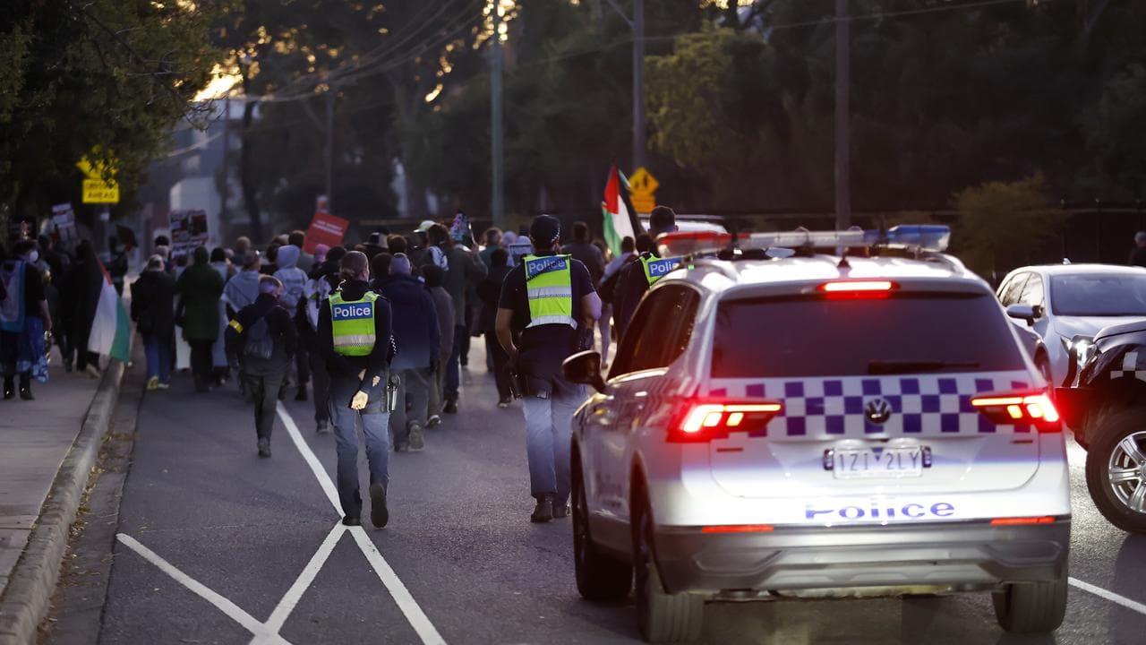 Police are seen during a protest march