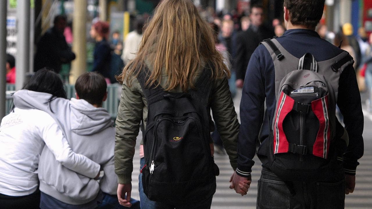 Teens holding hands