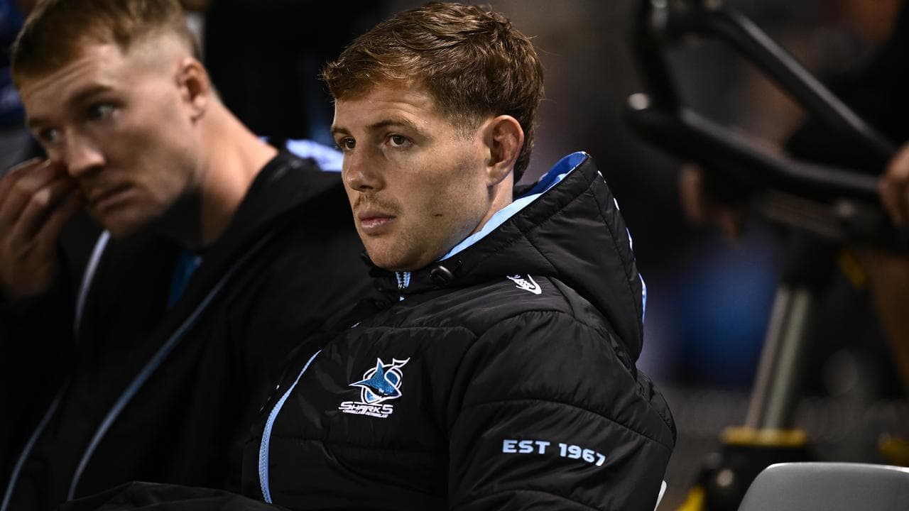 Blayke Brailey of the Sharks watches on from the bench