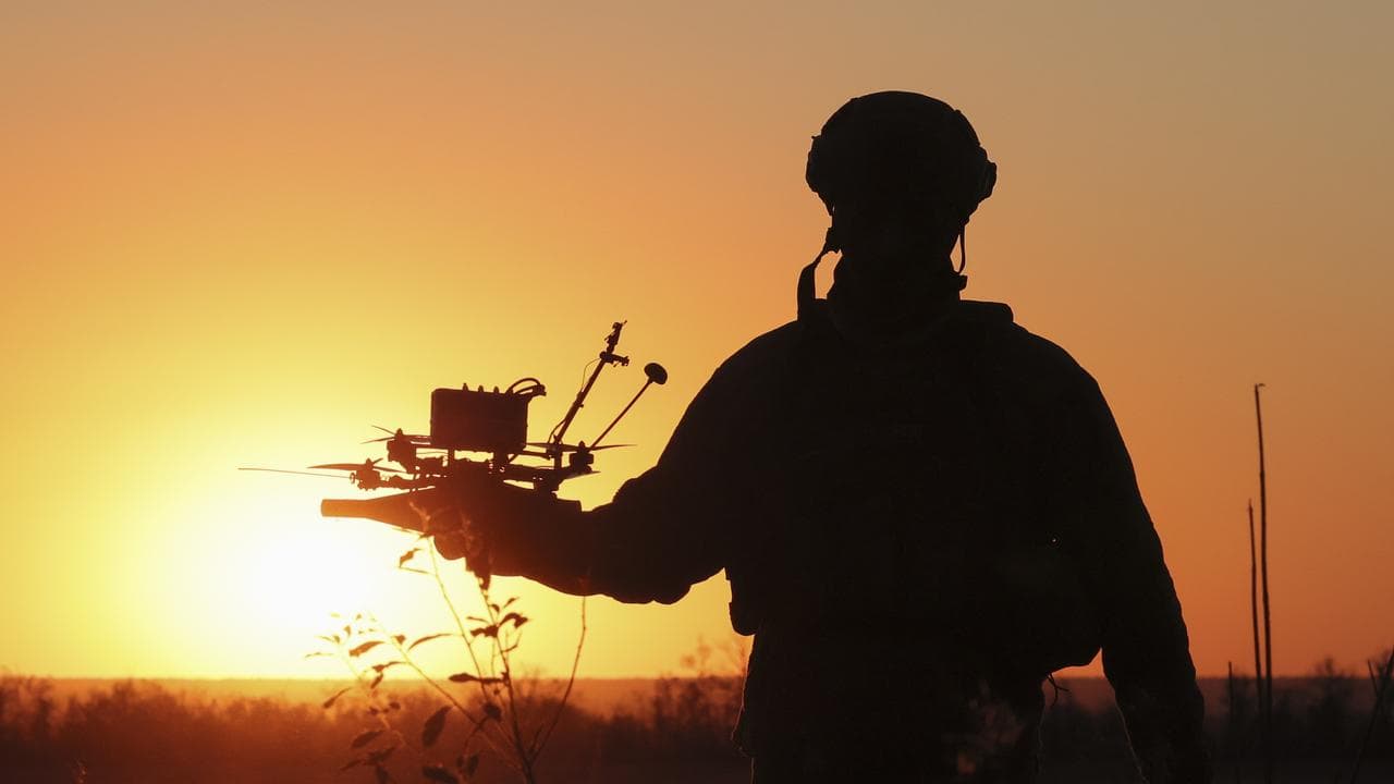 Ukrainian serviceman and drone