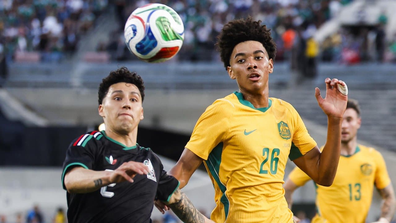 Jorge Sanchez and Australia defender Lucas Herrington