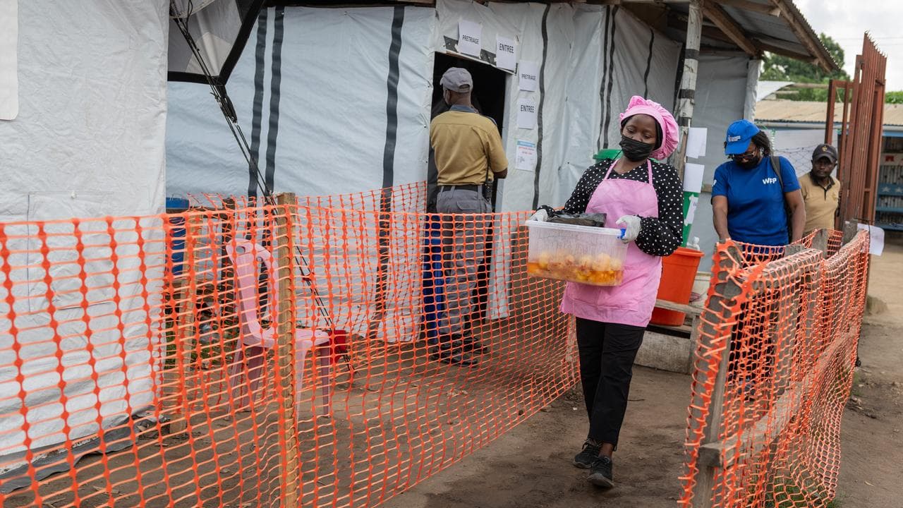 A cook, delivers meals to Ebola patients at a medical centre in Congo
