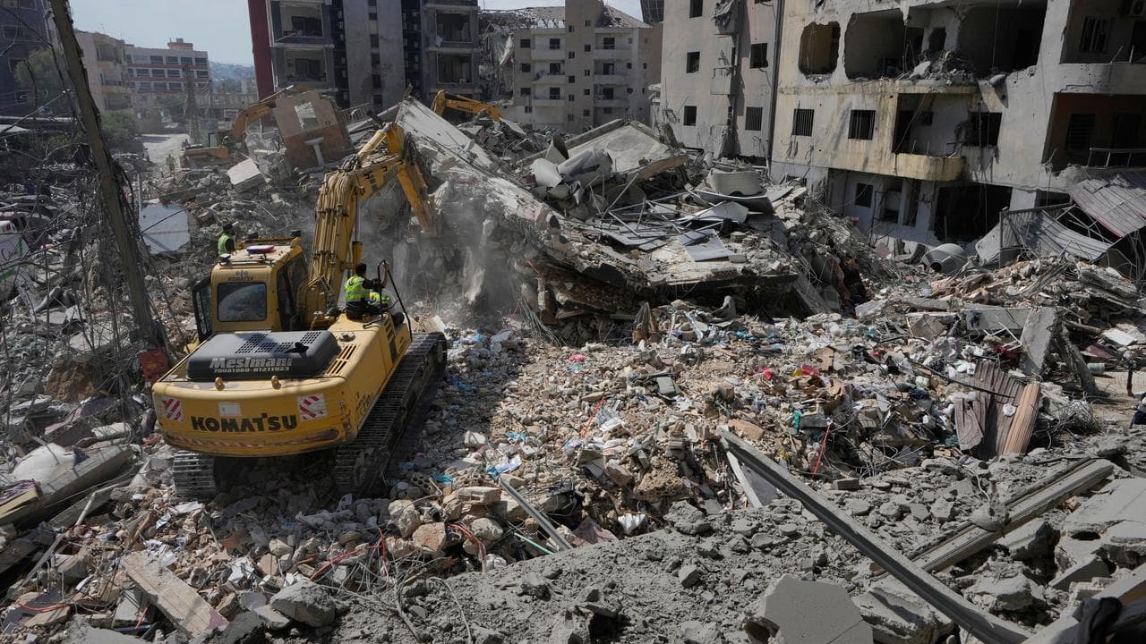Rescuers search for victims after an Israeli strike in Tyre, Lebanon