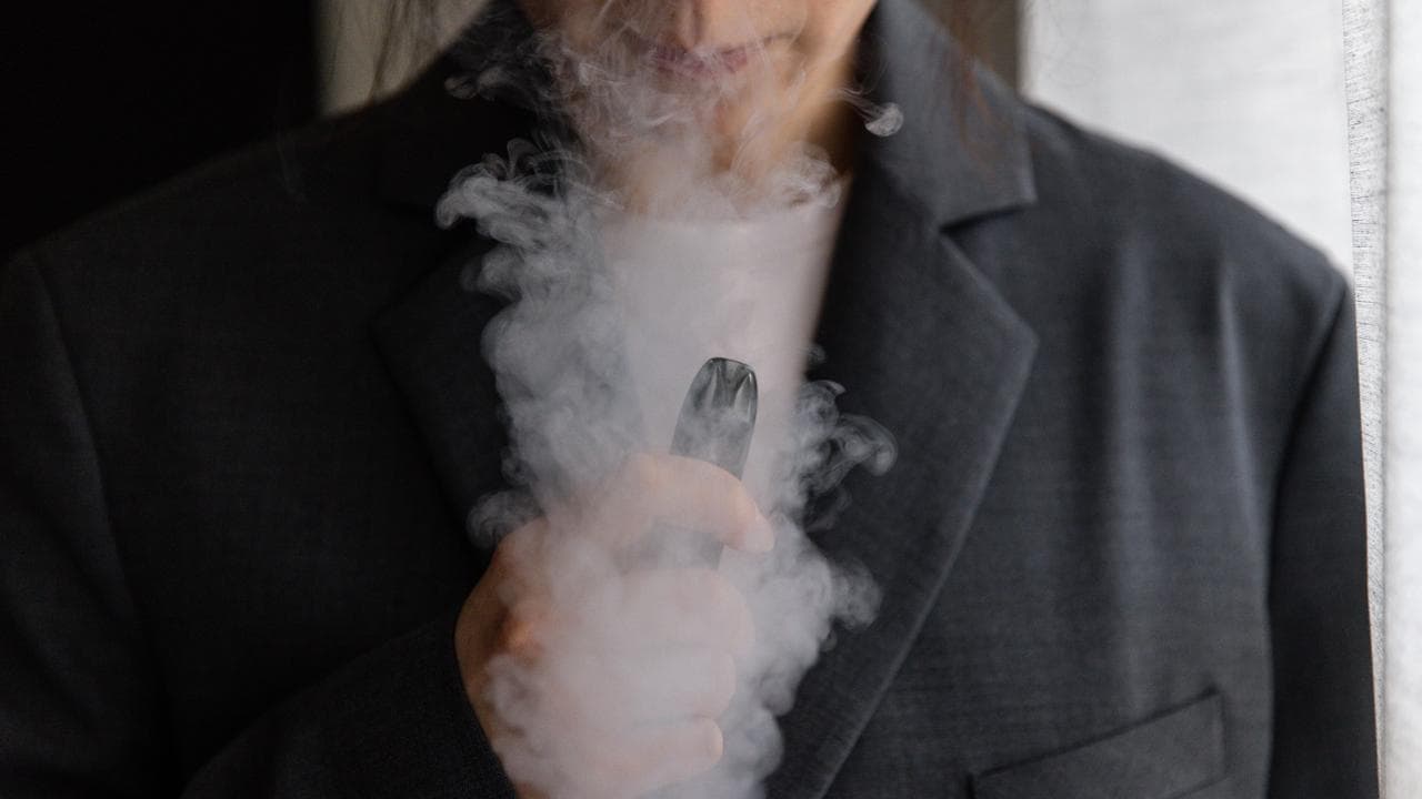 A woman is seen vaping (file image)