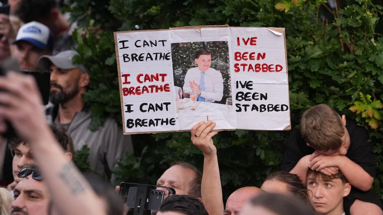 People protest outside the police station in England
