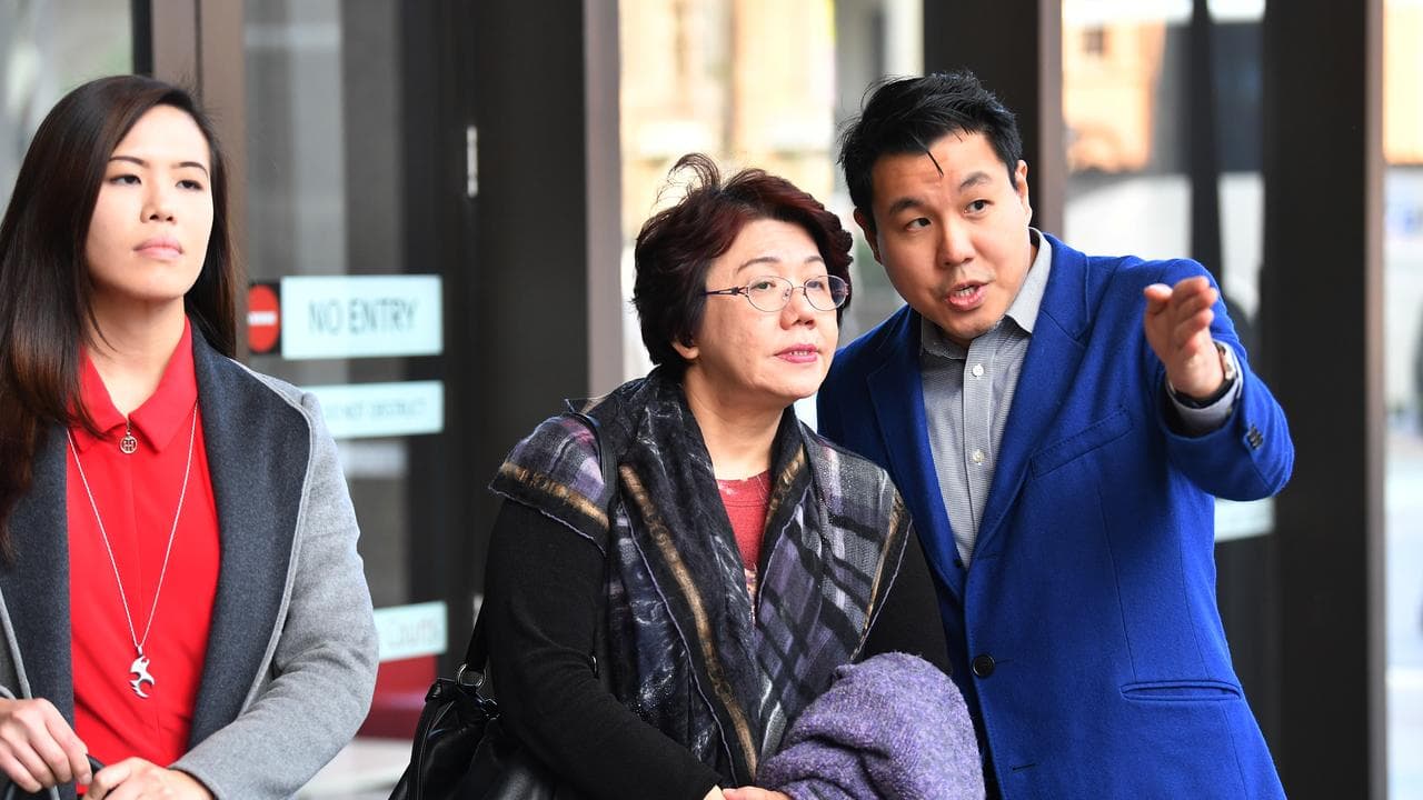 Curtis Cheng's daughter Zilvia, wife Selina and son Alpha (file)