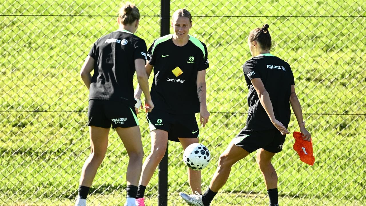 Steph Catley, Emily van Egmond and Caitlin Foord