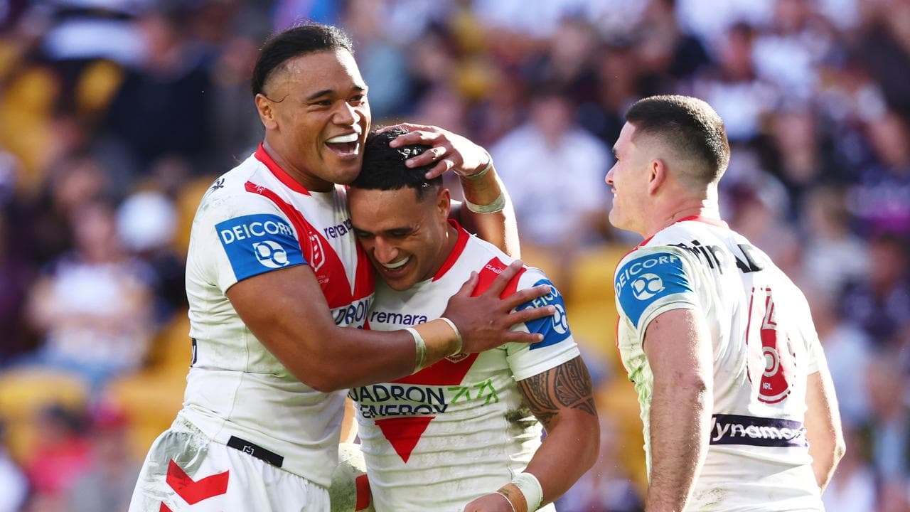 Dragons players celebrate.
