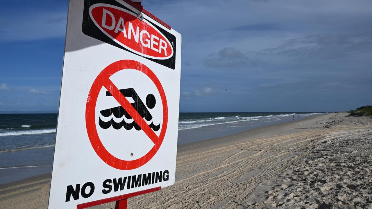 A sign warning against swimming