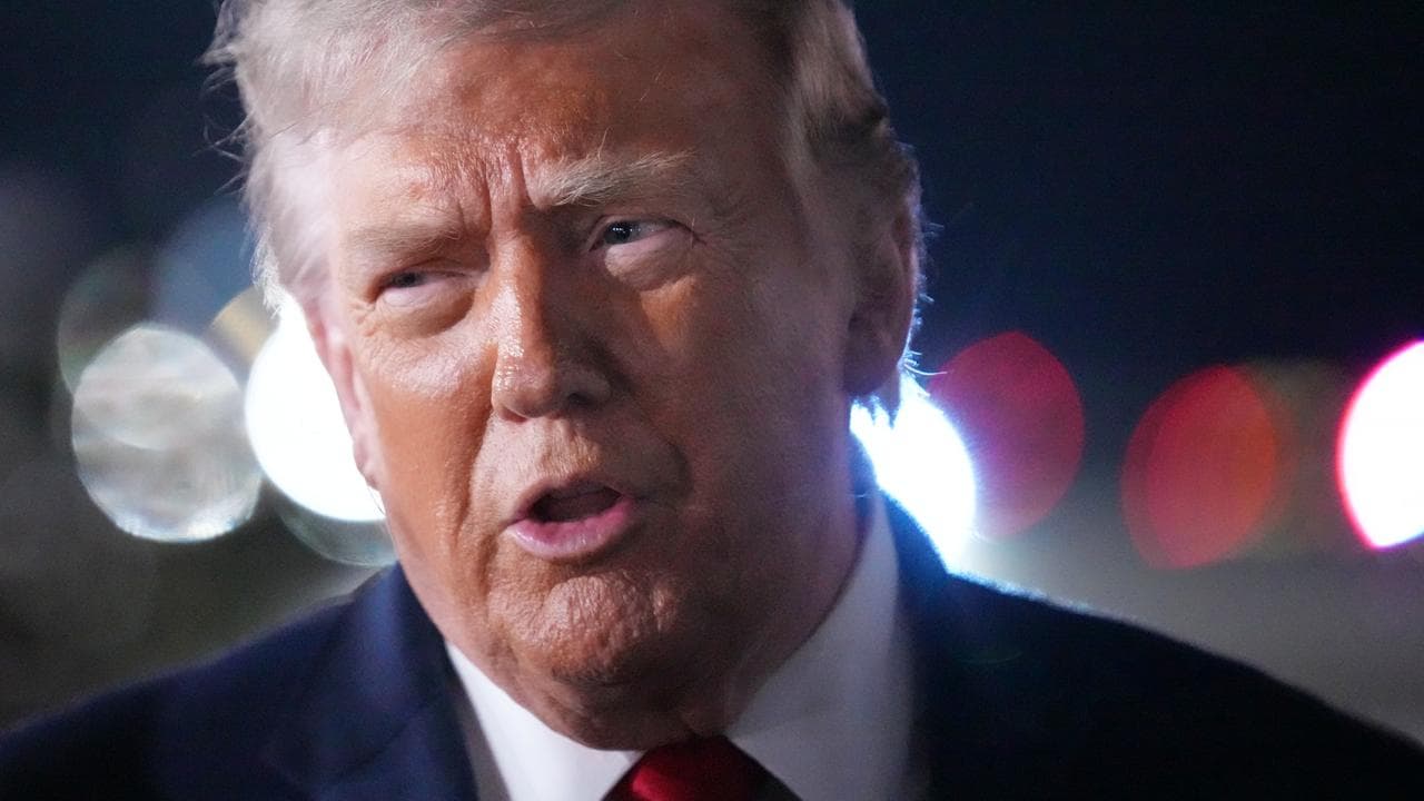 US President Donald Trump speaks to reporters at JFK airport