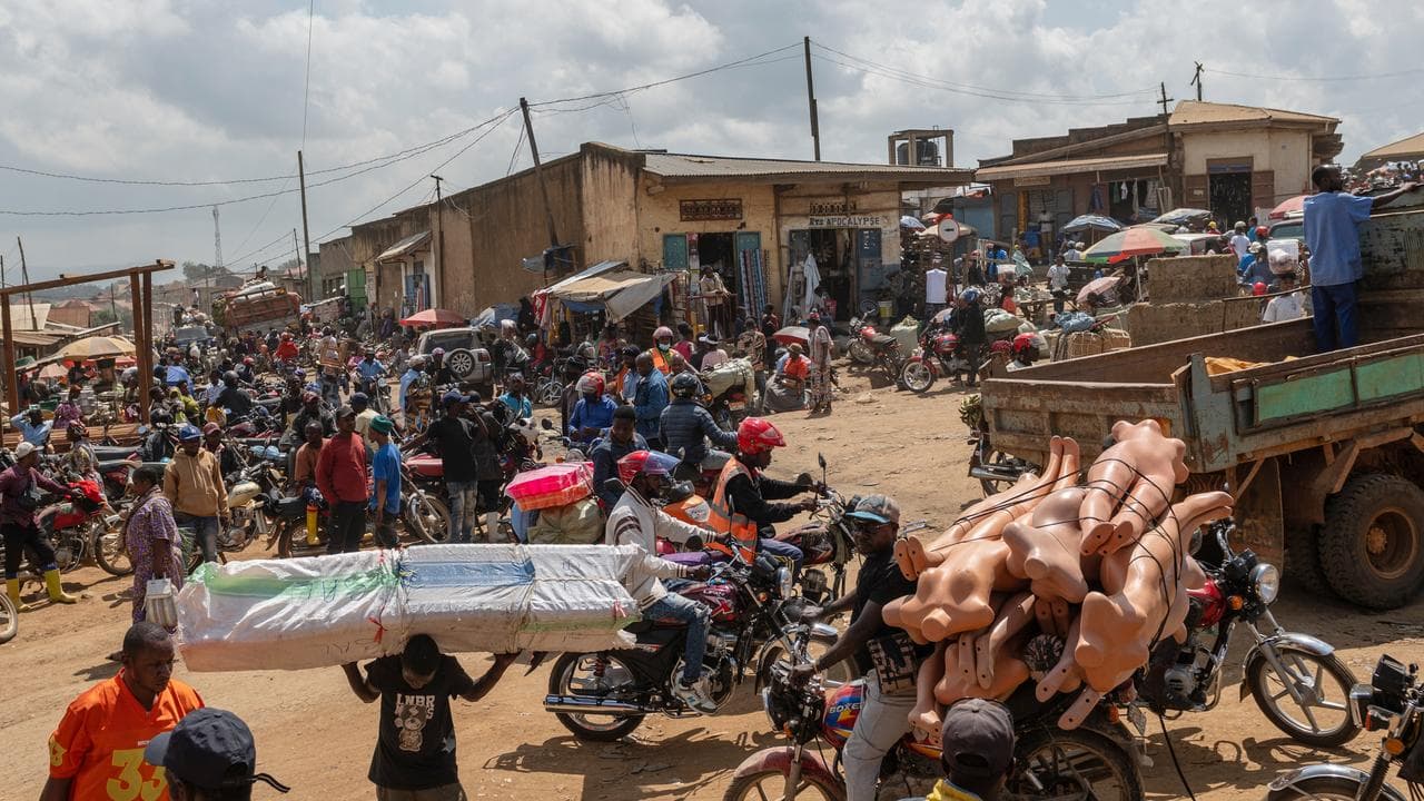 Motorcycles, trucks and pedestrians in Bunia, Congo