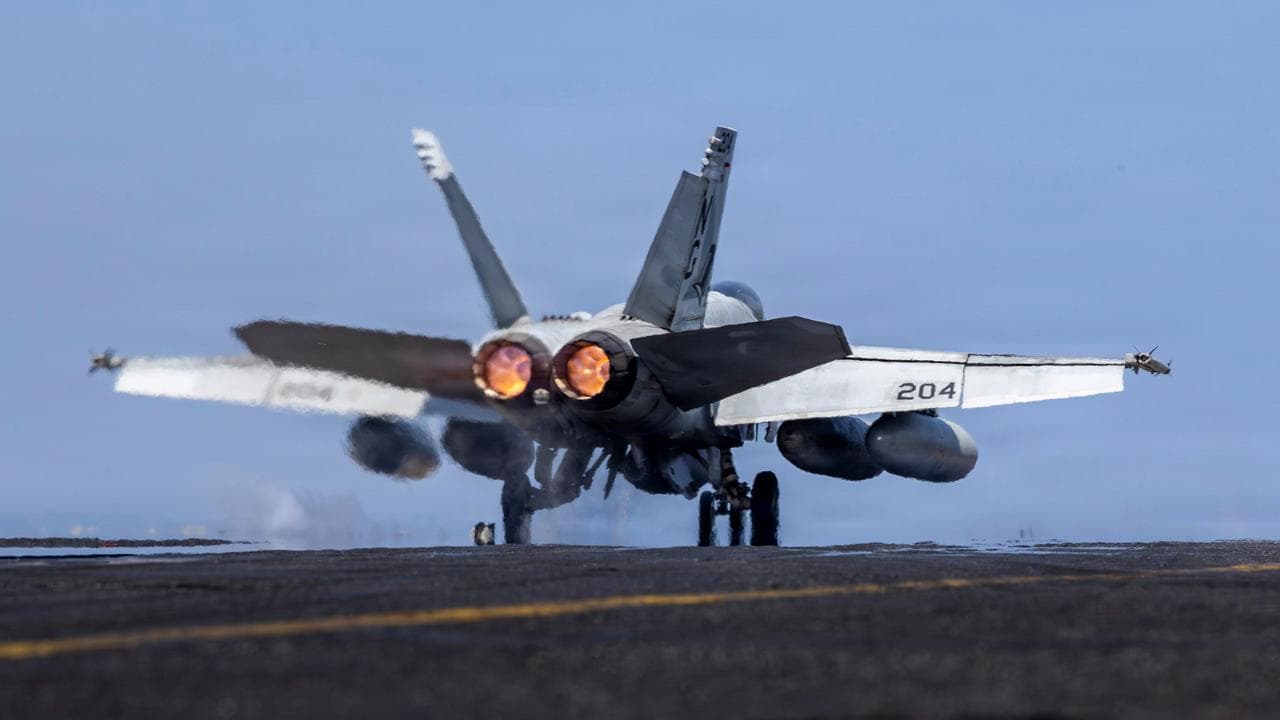 F/A-18E Super Hornet launching from the USS Abraham Lincoln